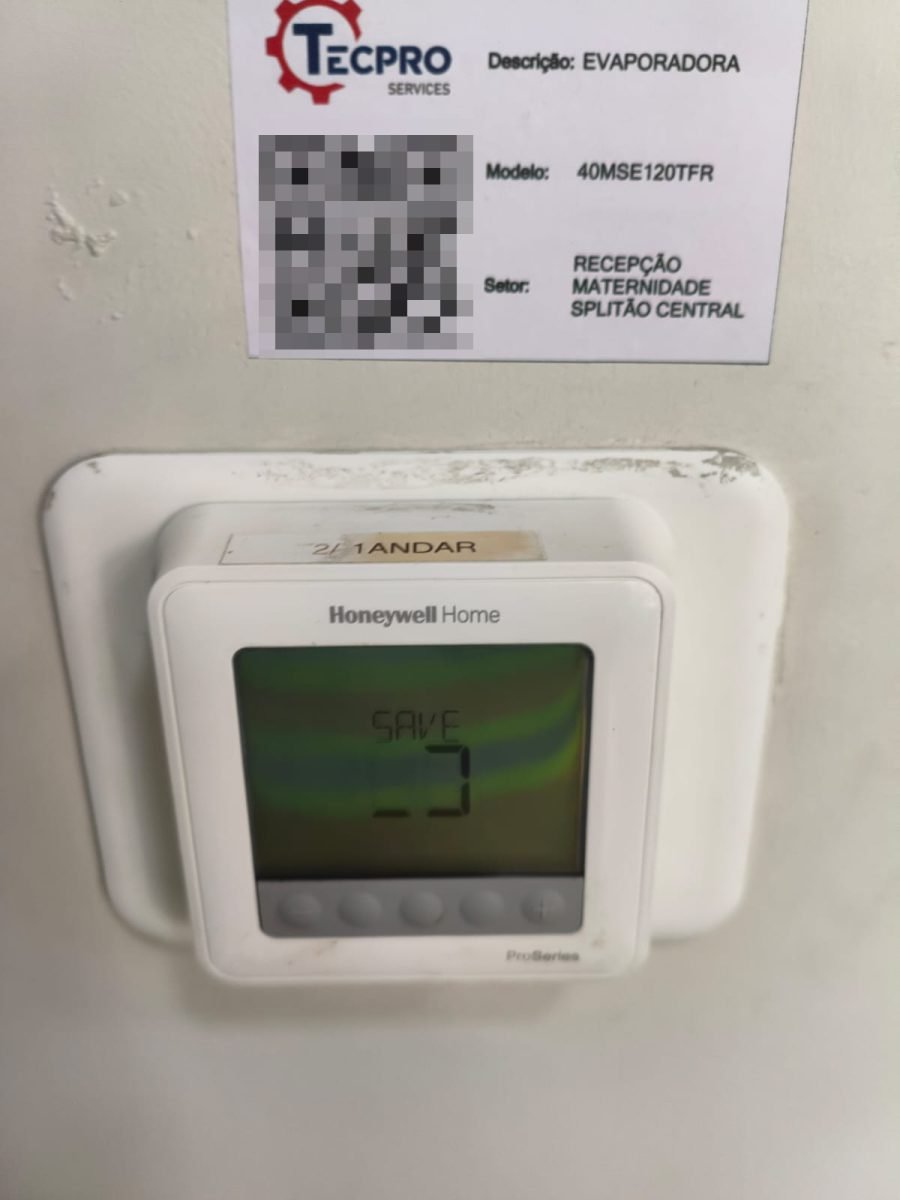 Tecpro Services asset identification label on an evaporator next to the room thermostat